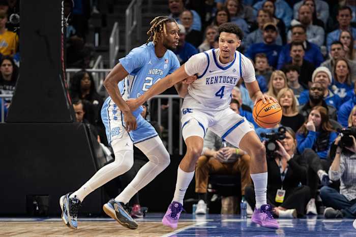 Dec 16, 2023; Atlanta, Georgia, USA; North Carolina Tar Heels forward Jae'Lyn Withers (24) defends the goal against Kentucky Wildcats forward Tre Mitchell (4) during the second half at State Farm Arena. Mandatory Credit: Jordan Godfree-USA TODAY Sports